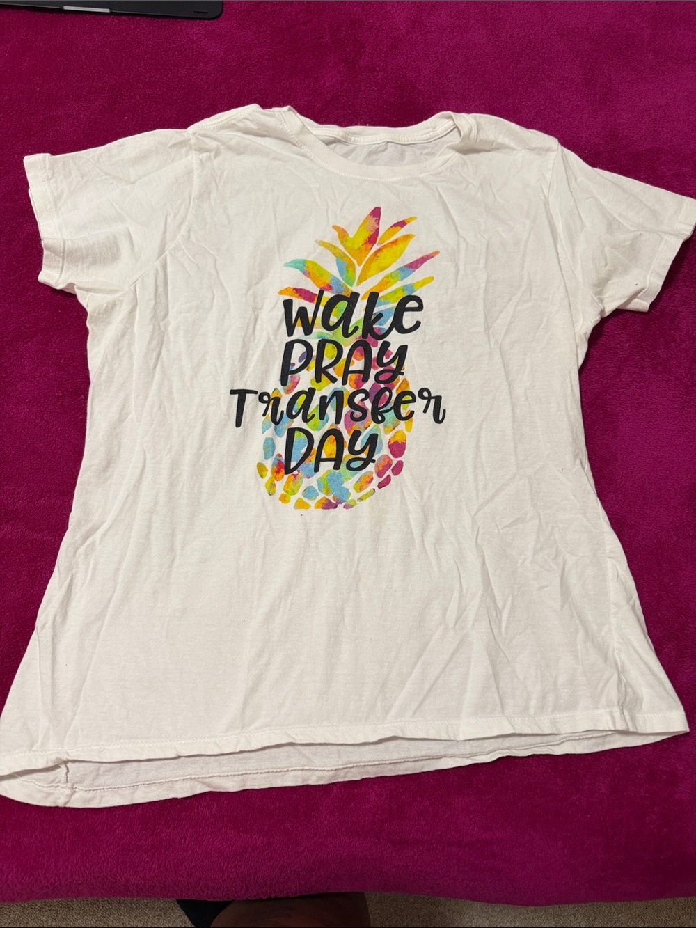 White Graphic Tee with Colorful Pineapple and 'Wake Pray Transfer Day' Text